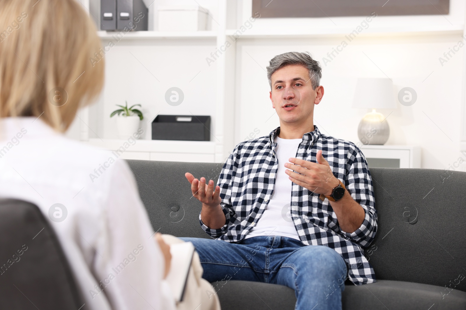 Photo of Professional psychologist working with patient in office