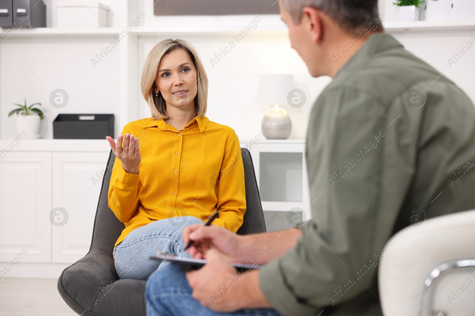 Photo of Professional psychologist working with patient in office