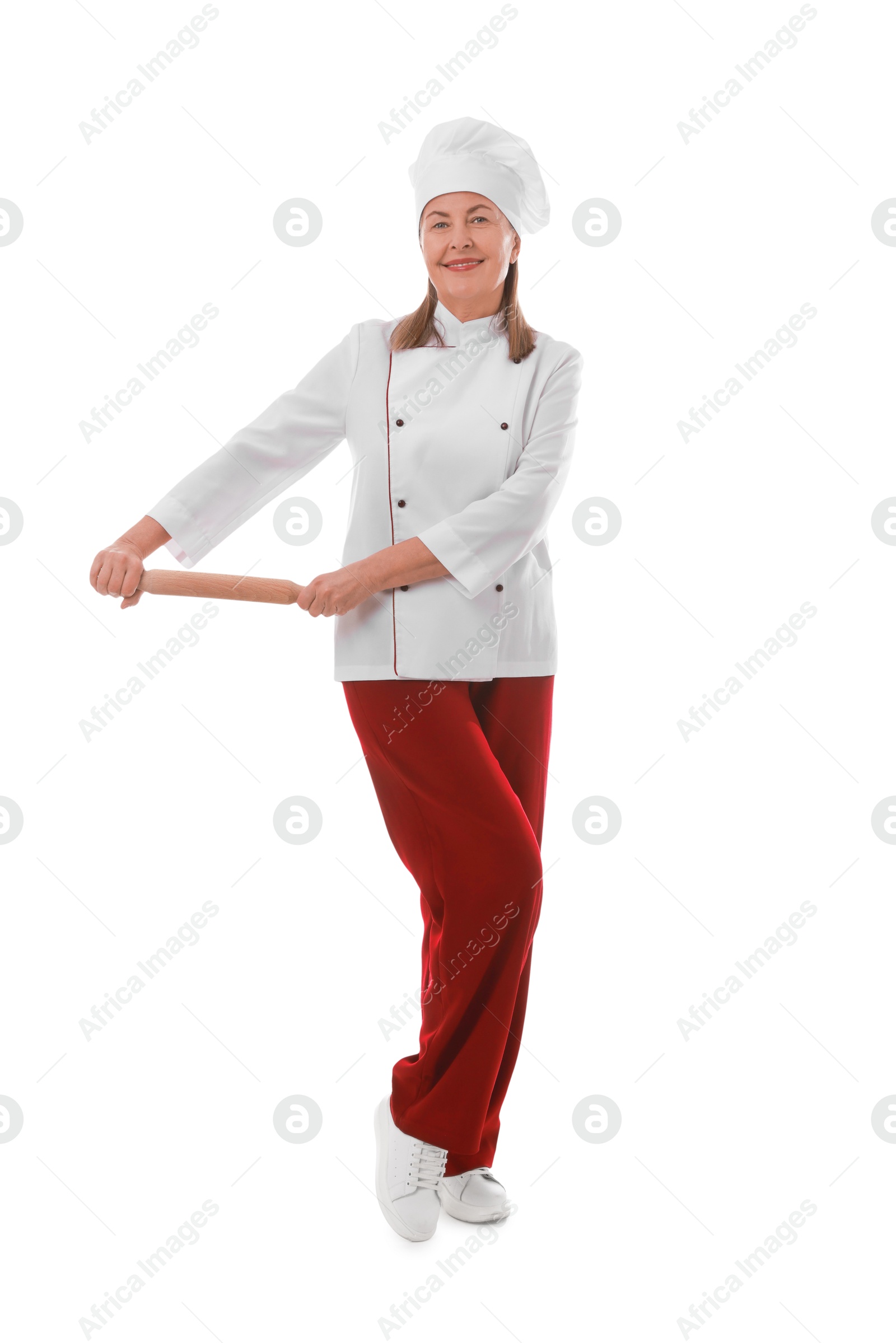 Photo of Happy chef with rolling pin on white background