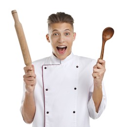 Photo of Excited chef with rolling pin and ladle on white background