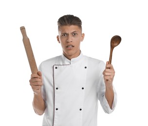 Photo of Confused chef with rolling pin and ladle on white background