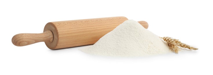 Photo of Wooden rolling pin and pile of flour isolated on white