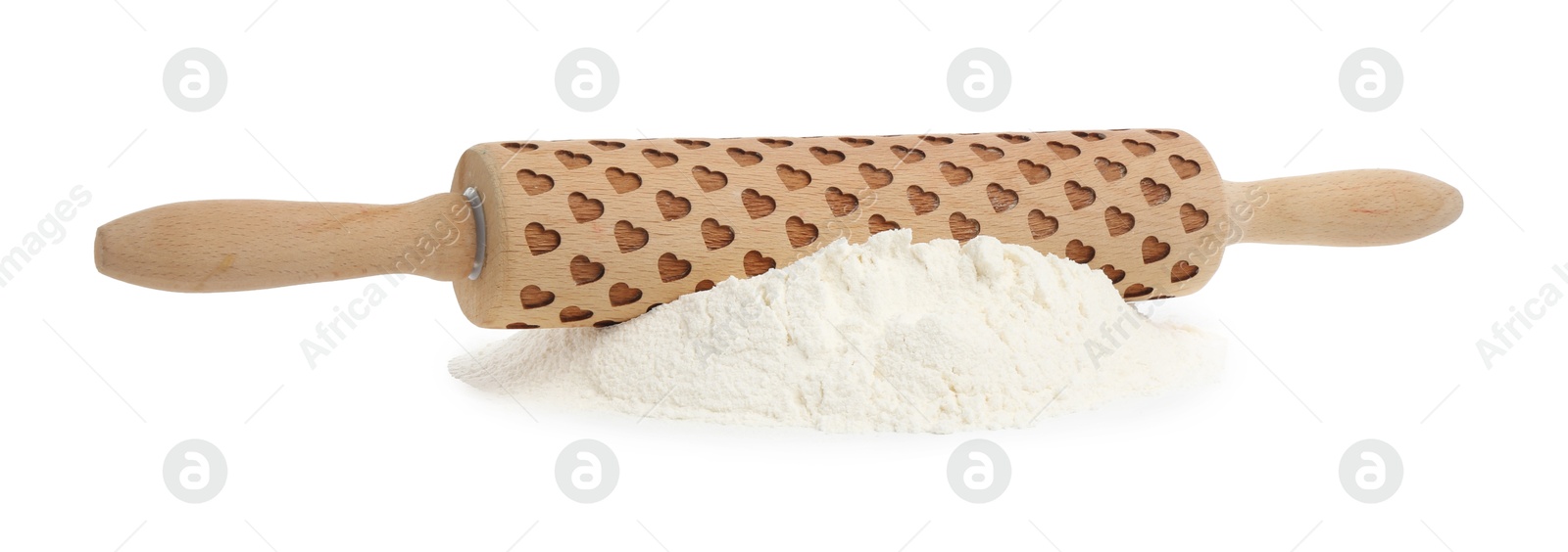 Photo of Patterned wooden rolling pin and pile of flour isolated on white