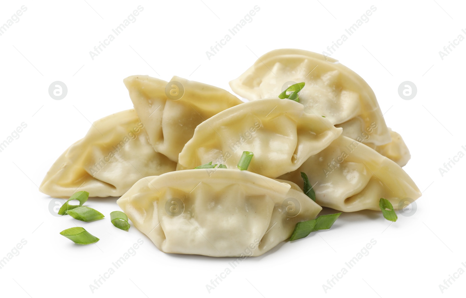 Photo of Fresh gyoza dumplings with pieces of green onion isolated on white