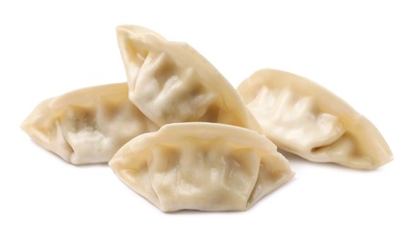 Photo of Fresh gyoza dumplings isolated on white. Chinese cuisine