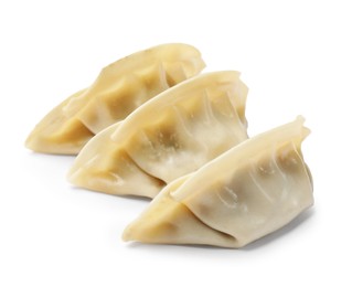 Photo of Fresh gyoza dumplings isolated on white. Chinese cuisine