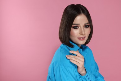 Photo of Portrait of beautiful young woman with gorgeous straight hair on pink background, space for text