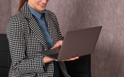 Photo of Banker working with laptop in office, space for text