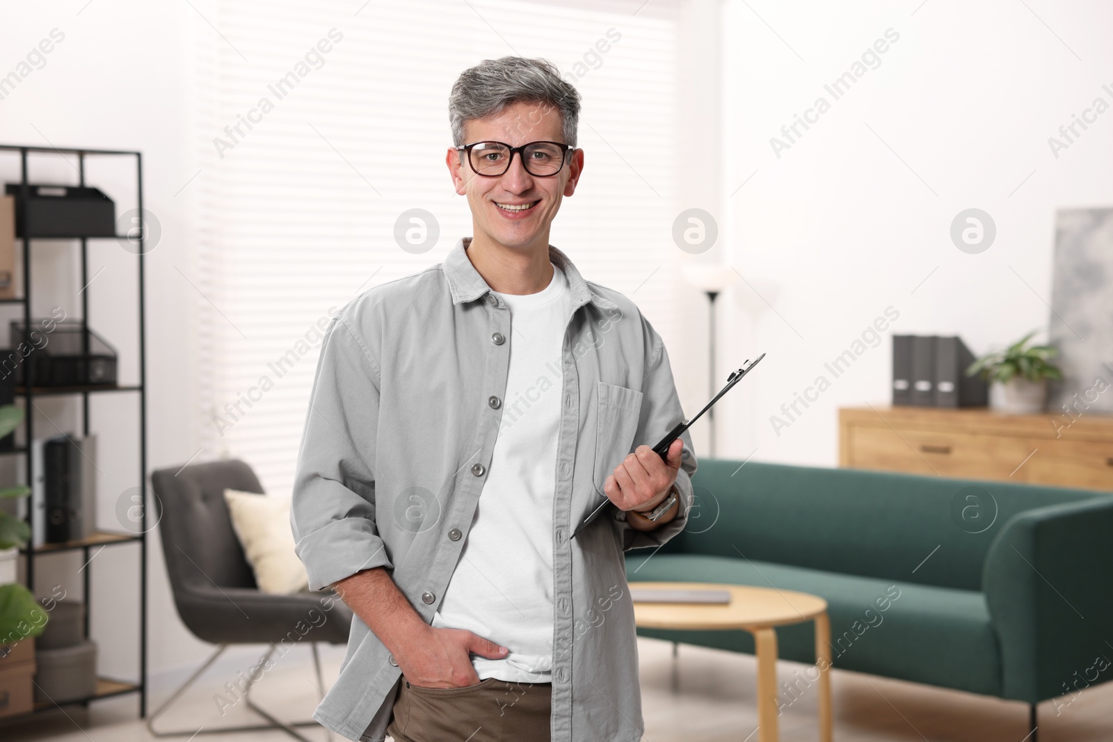 Photo of Portrait of professional psychologist with clipboard in office