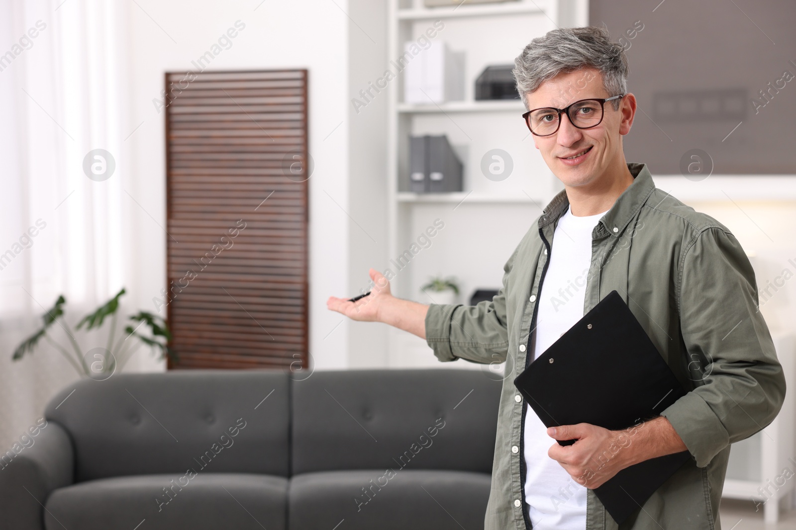 Photo of Portrait of professional psychologist with clipboard in office, space for text