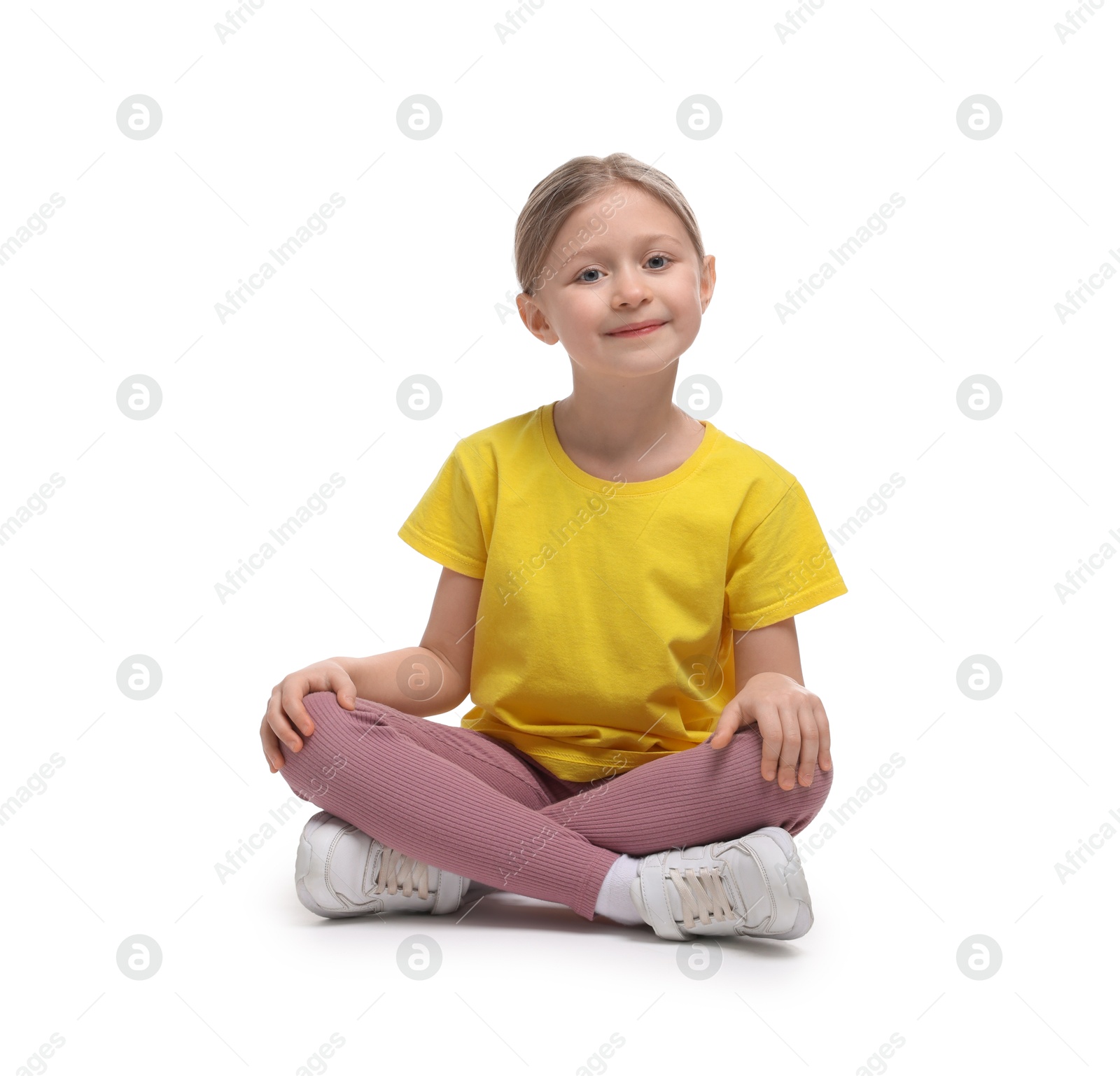 Photo of Cute little girl in sportswear on white background