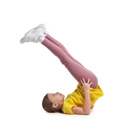 Photo of Cute little girl exercising on white background