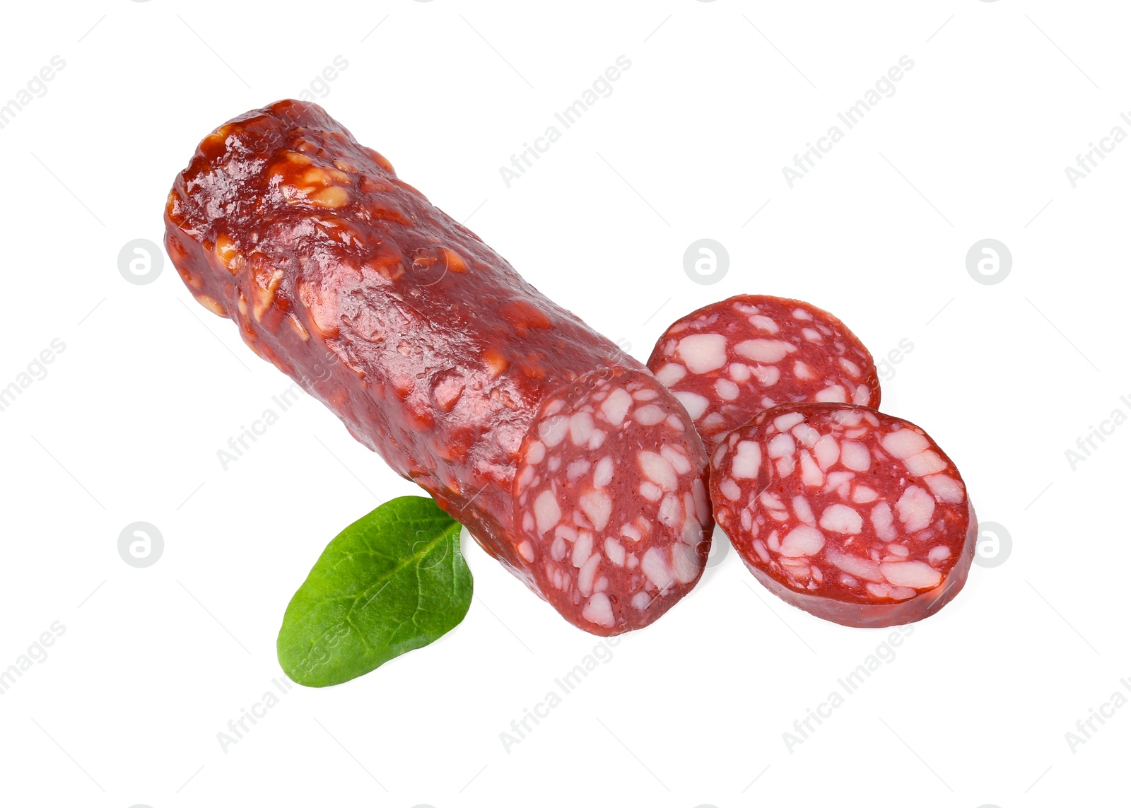 Photo of Delicious dry cured sausage and spinach isolated on white, top view