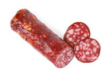 Photo of Delicious dry cured sausage isolated on white, top view