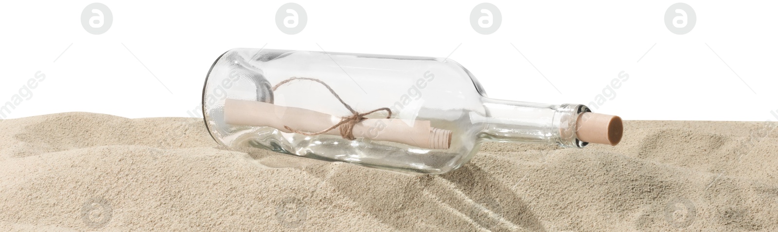 Photo of Rolled letter in corked glass bottle on sand against white background