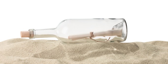 Photo of Rolled letter in corked glass bottle on sand against white background