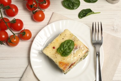 Photo of Delicious spinach lasagne served on white wooden table, flat lay