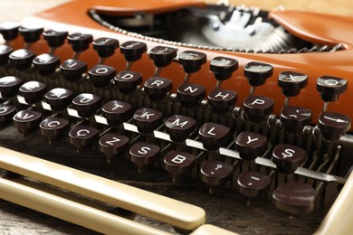 Photo of Old vintage typewriter machine on table, closeup