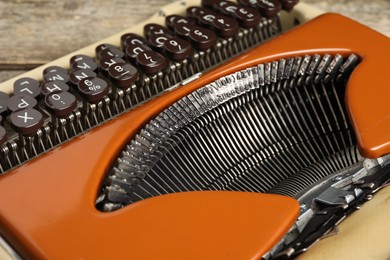 Photo of Old vintage typewriter machine on table, closeup
