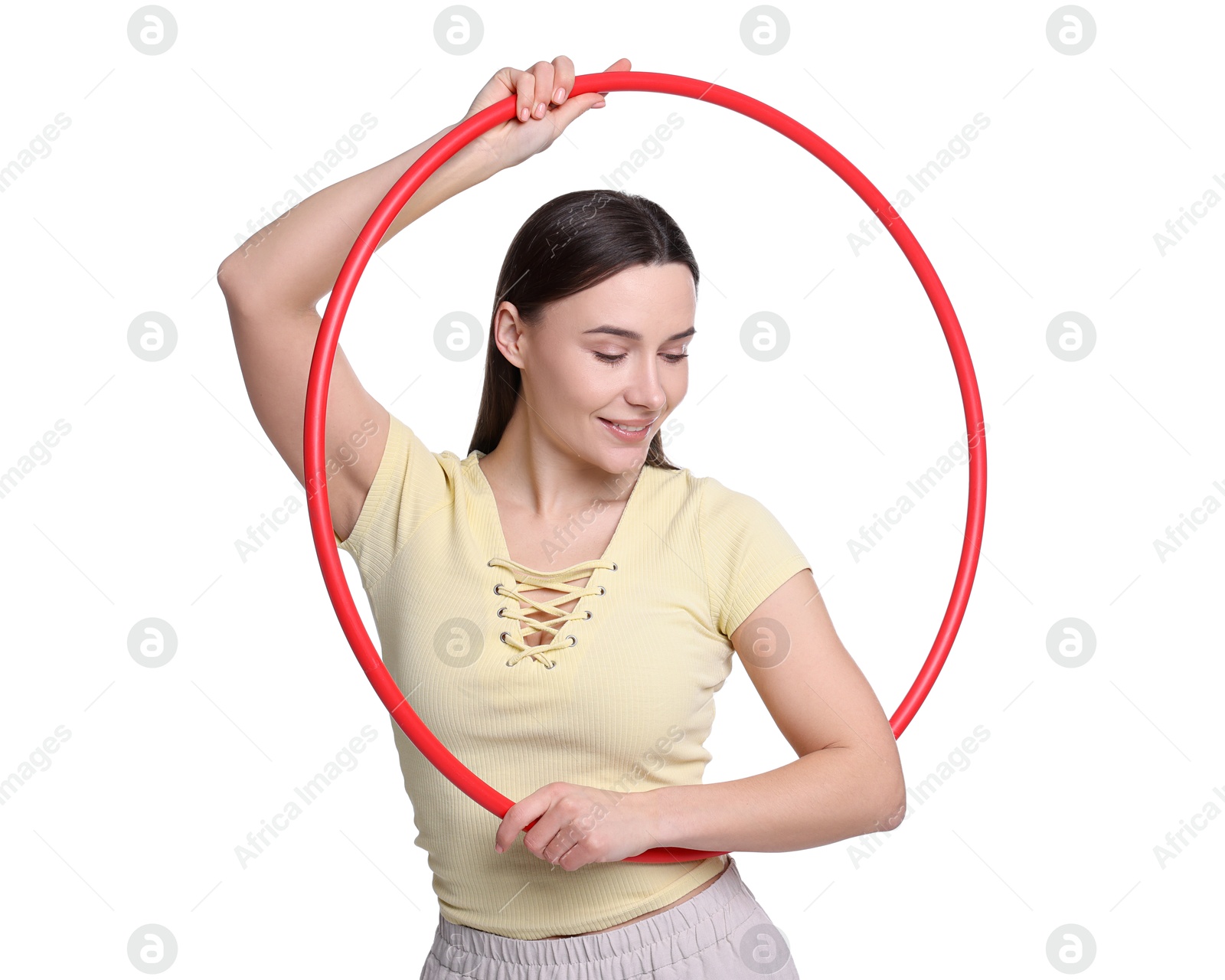 Photo of Smiling woman with hula hoop on white background