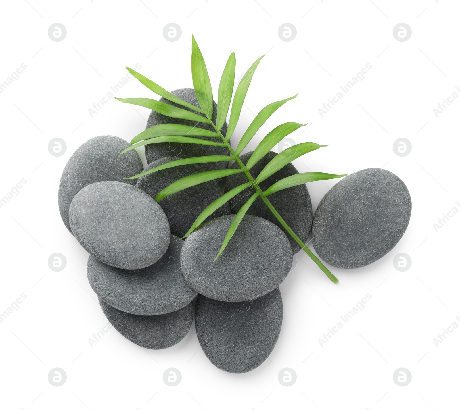 Photo of Spa stones with leaves isolated on white, top view