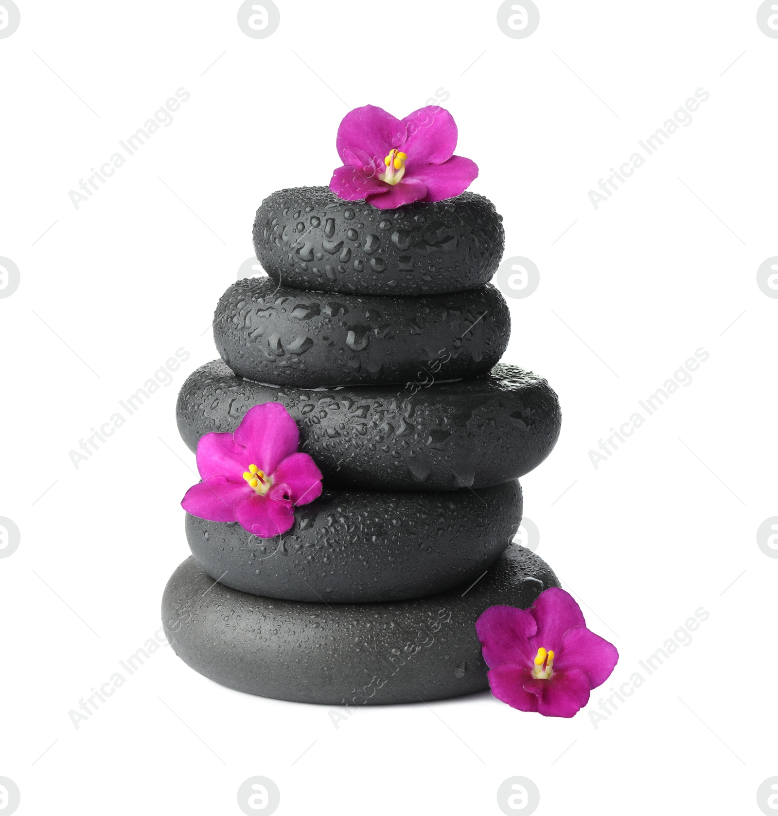 Photo of Stacked spa stones and beautiful flowers isolated on white