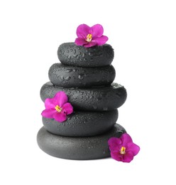 Photo of Stacked spa stones and beautiful flowers isolated on white