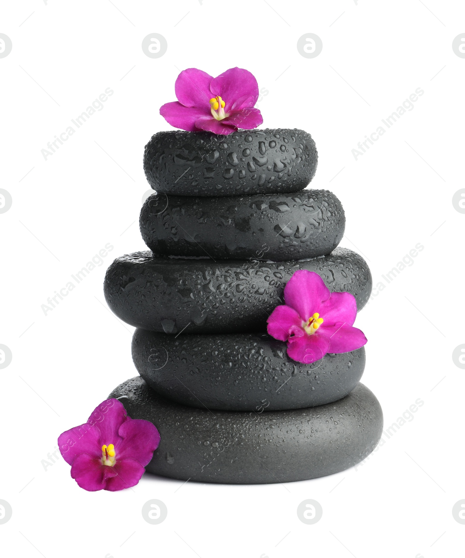 Photo of Stacked spa stones and beautiful flowers isolated on white