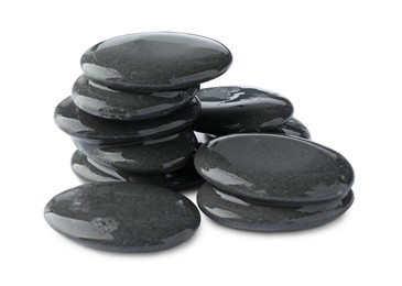 Photo of Stacked wet spa stones isolated on white