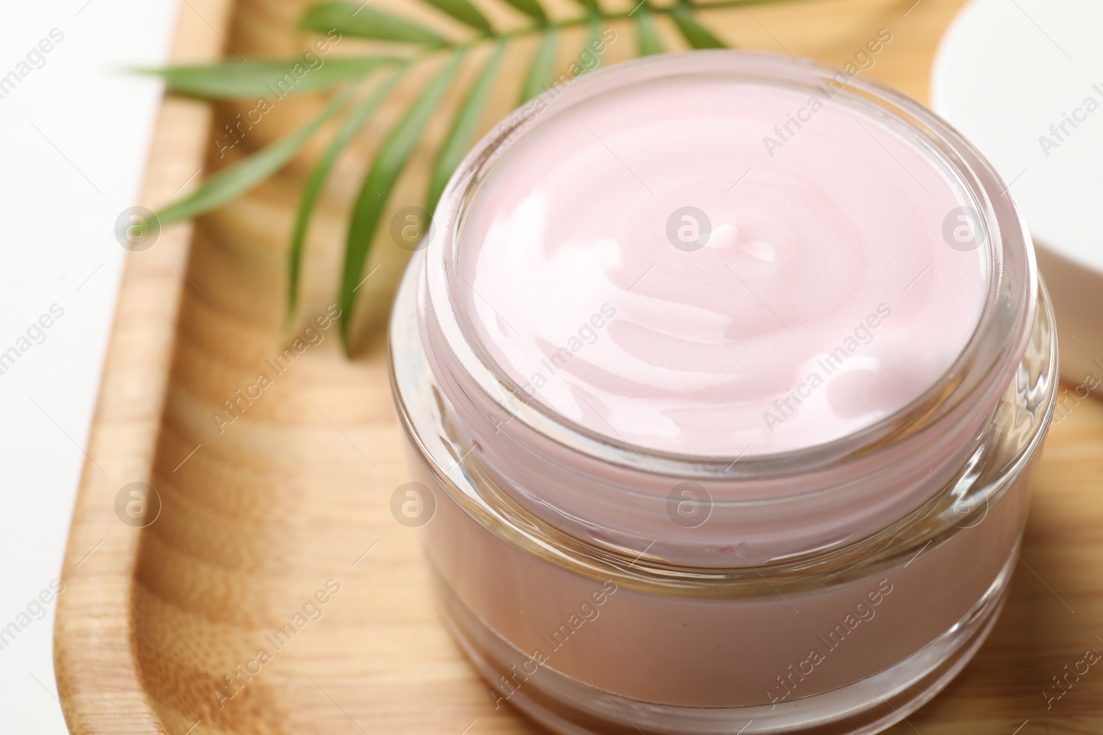 Photo of Jar of cream on table, closeup view