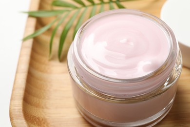 Photo of Jar of cream on table, closeup view