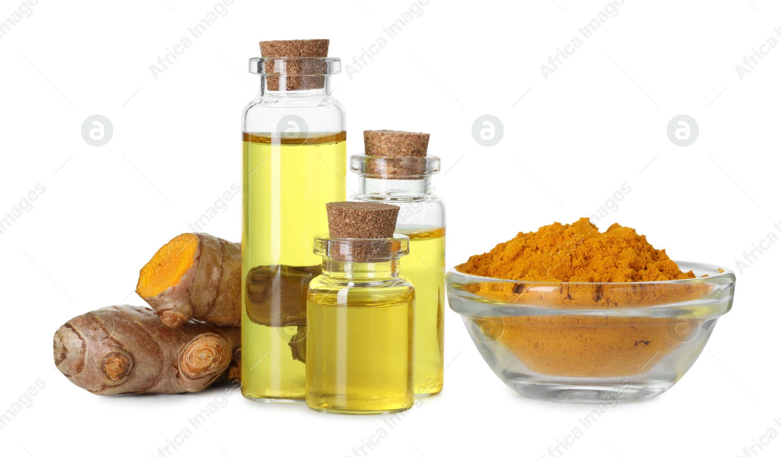 Photo of Bottles of turmeric essential oil, powder and raw roots isolated on white