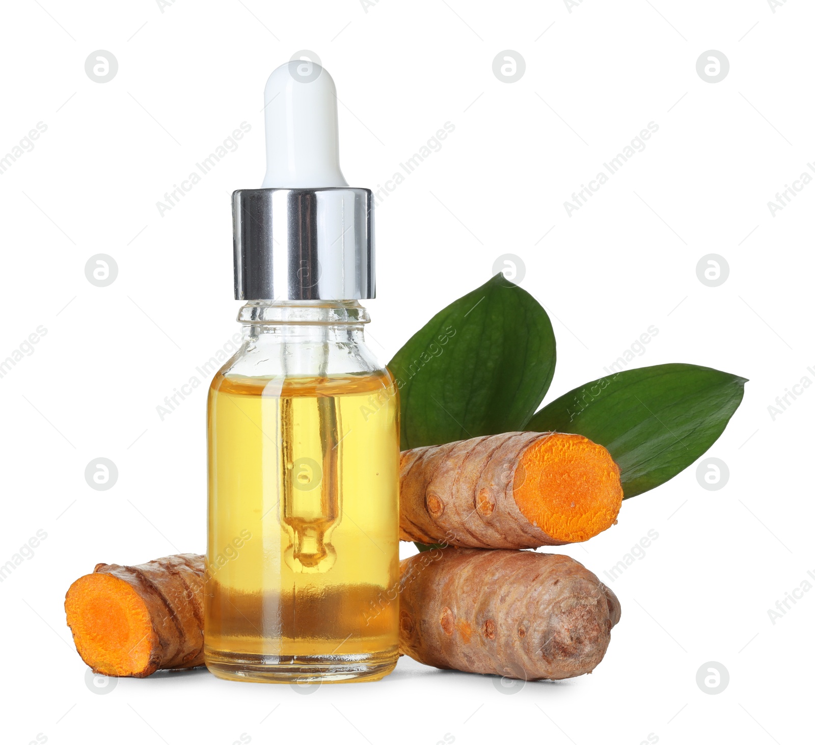 Photo of Bottle of turmeric essential oil, raw roots and leaves isolated on white