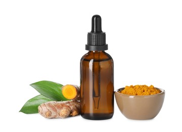 Photo of Bottle of turmeric essential oil, powder, raw roots and leaves isolated on white