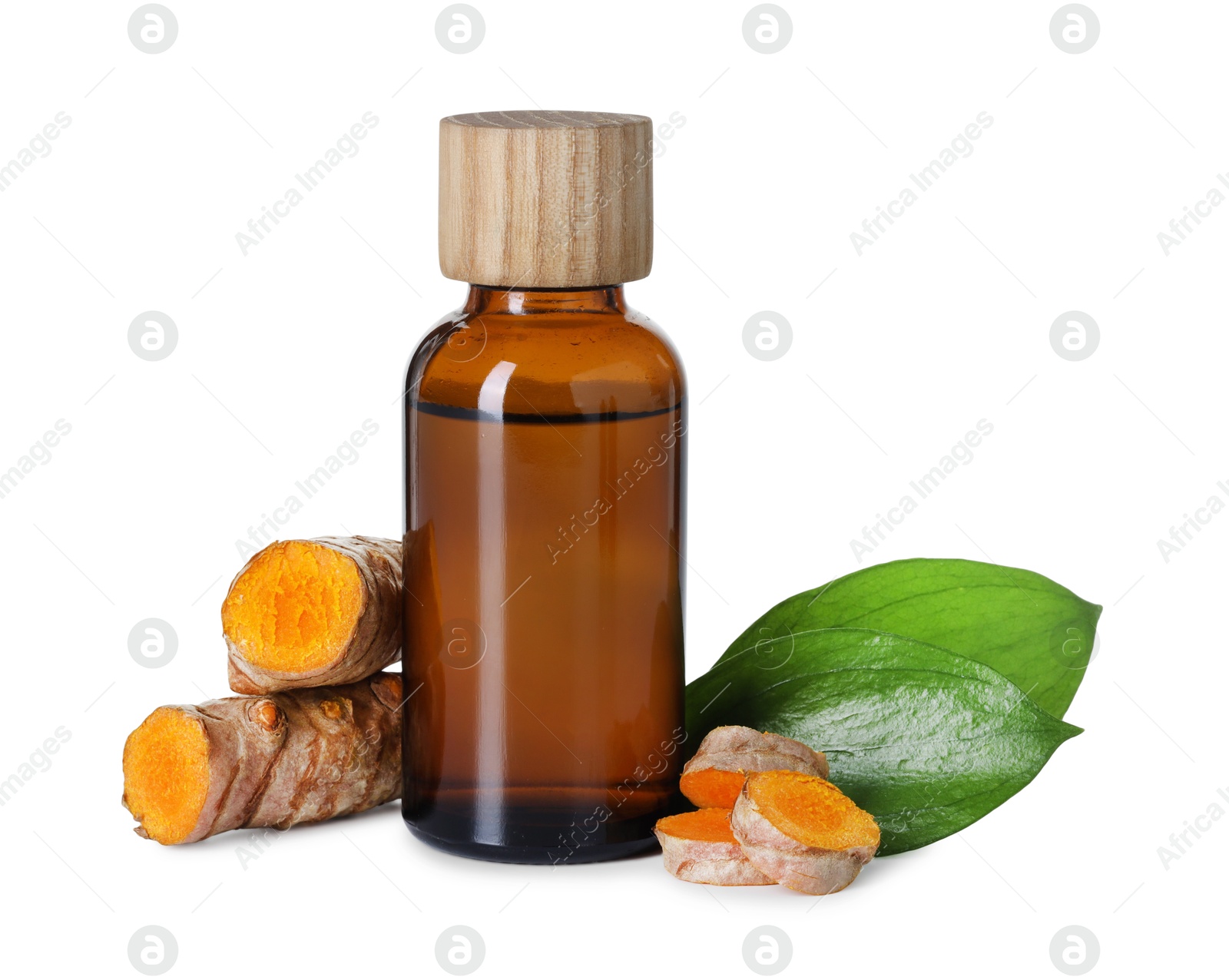 Photo of Bottle of turmeric essential oil, raw roots and leaves isolated on white