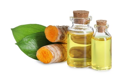 Photo of Bottles of turmeric essential oil, raw roots and leaves isolated on white