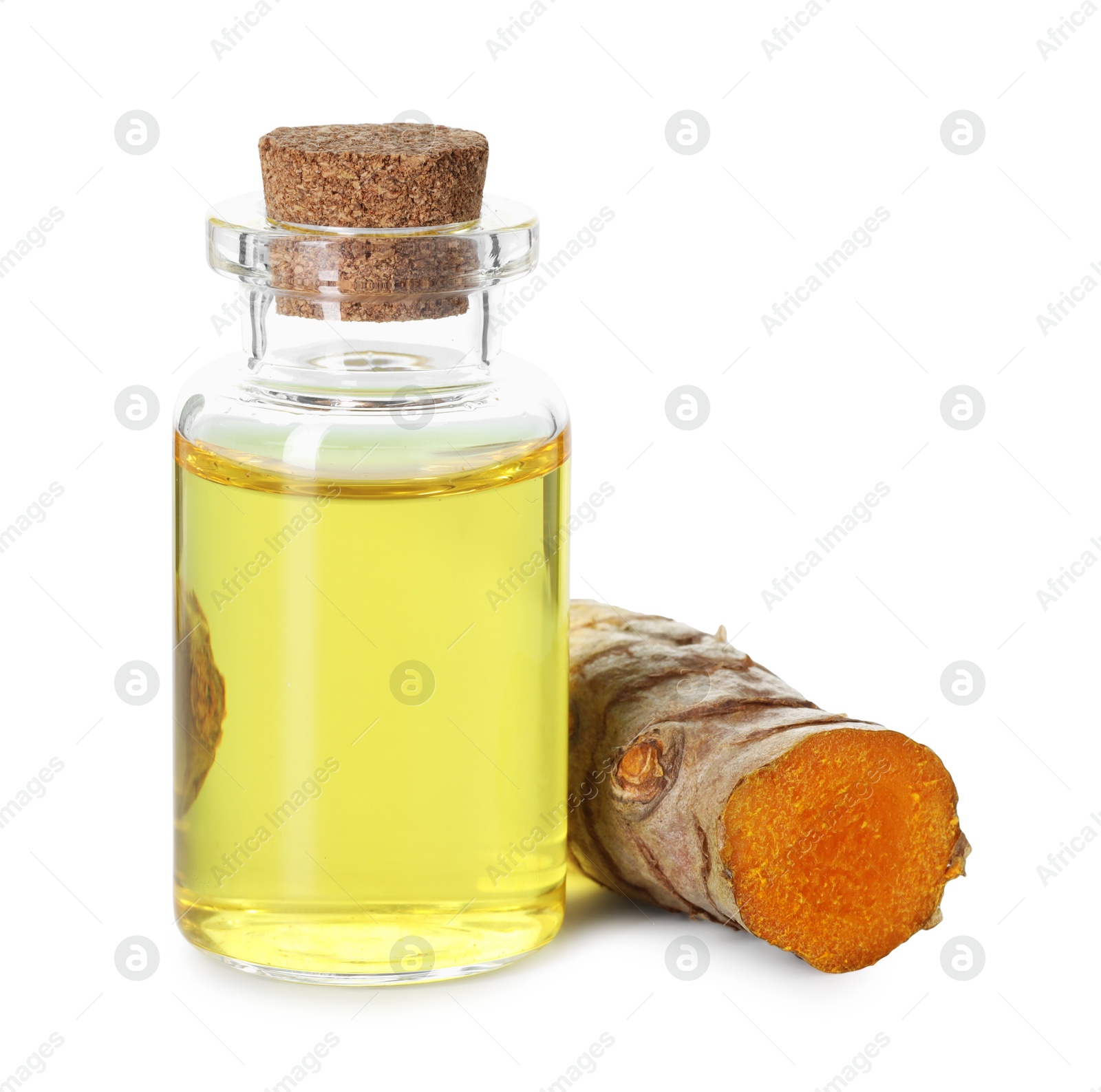 Photo of Bottle of turmeric essential oil and raw root isolated on white