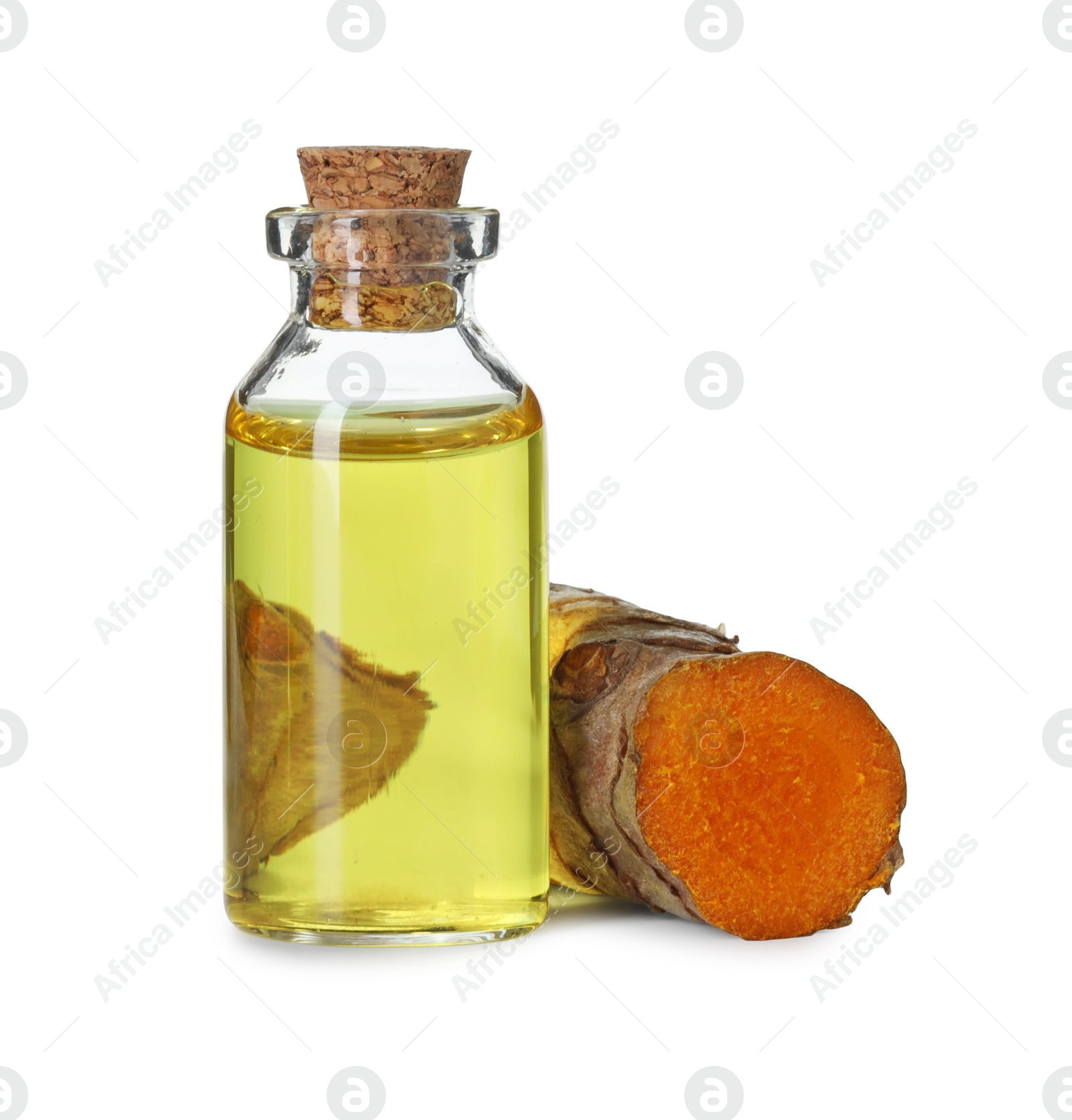 Photo of Bottle of turmeric essential oil and raw root isolated on white