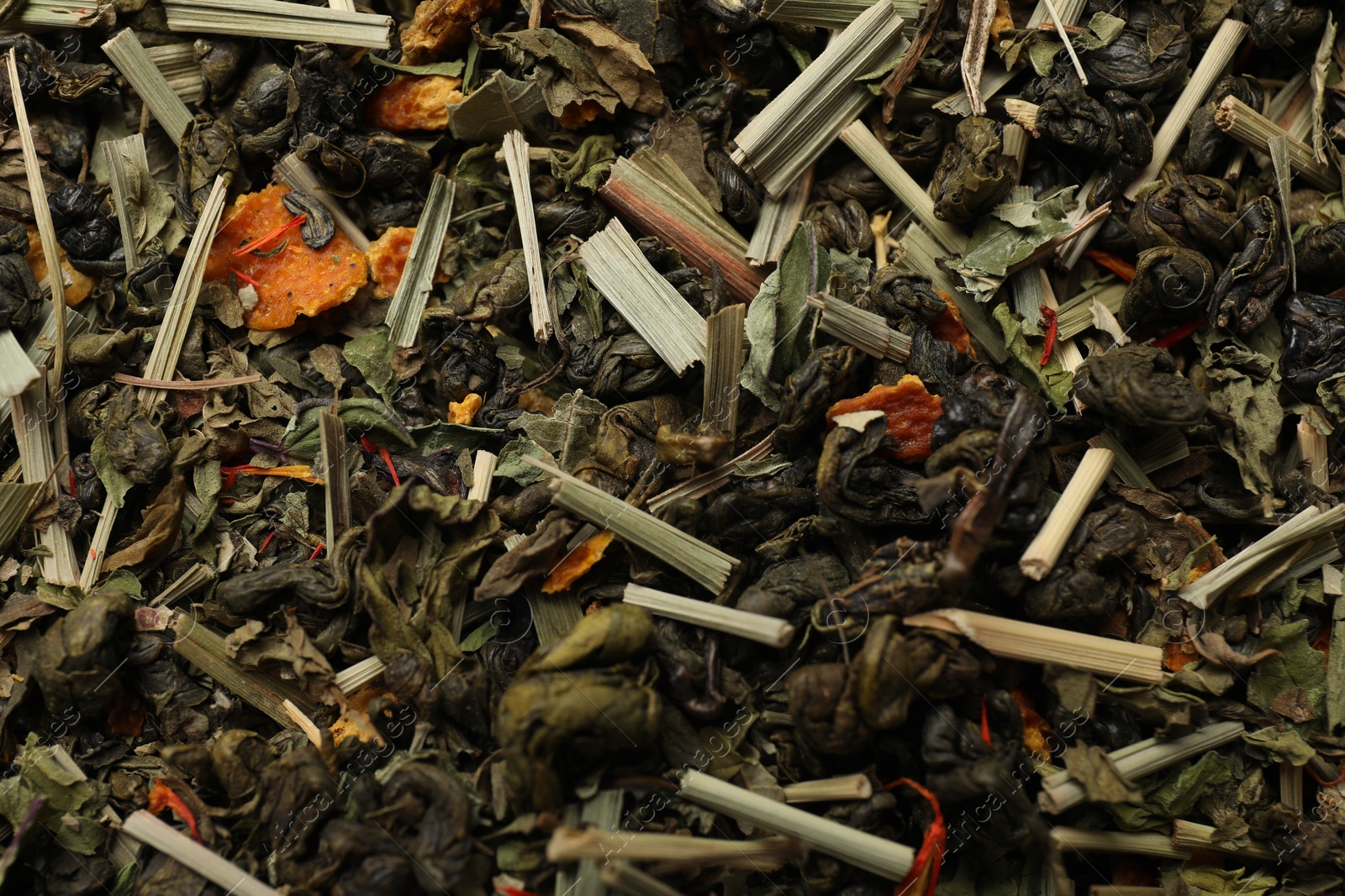 Photo of Pile of dry tea leaves as background, closeup