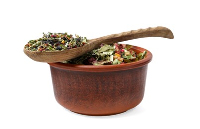 Photo of Dry herbal tea brew in bowl with spoon isolated on white