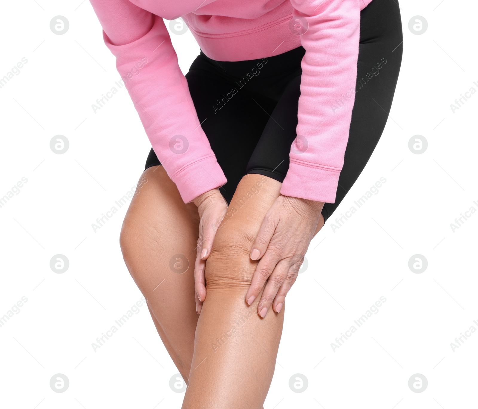 Photo of Woman suffering from pain in her knee on white background, closeup