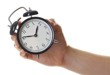 Photo of Man with black alarm clock on white background, closeup