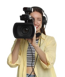 Photo of Happy woman with professional video camera and headset on white background