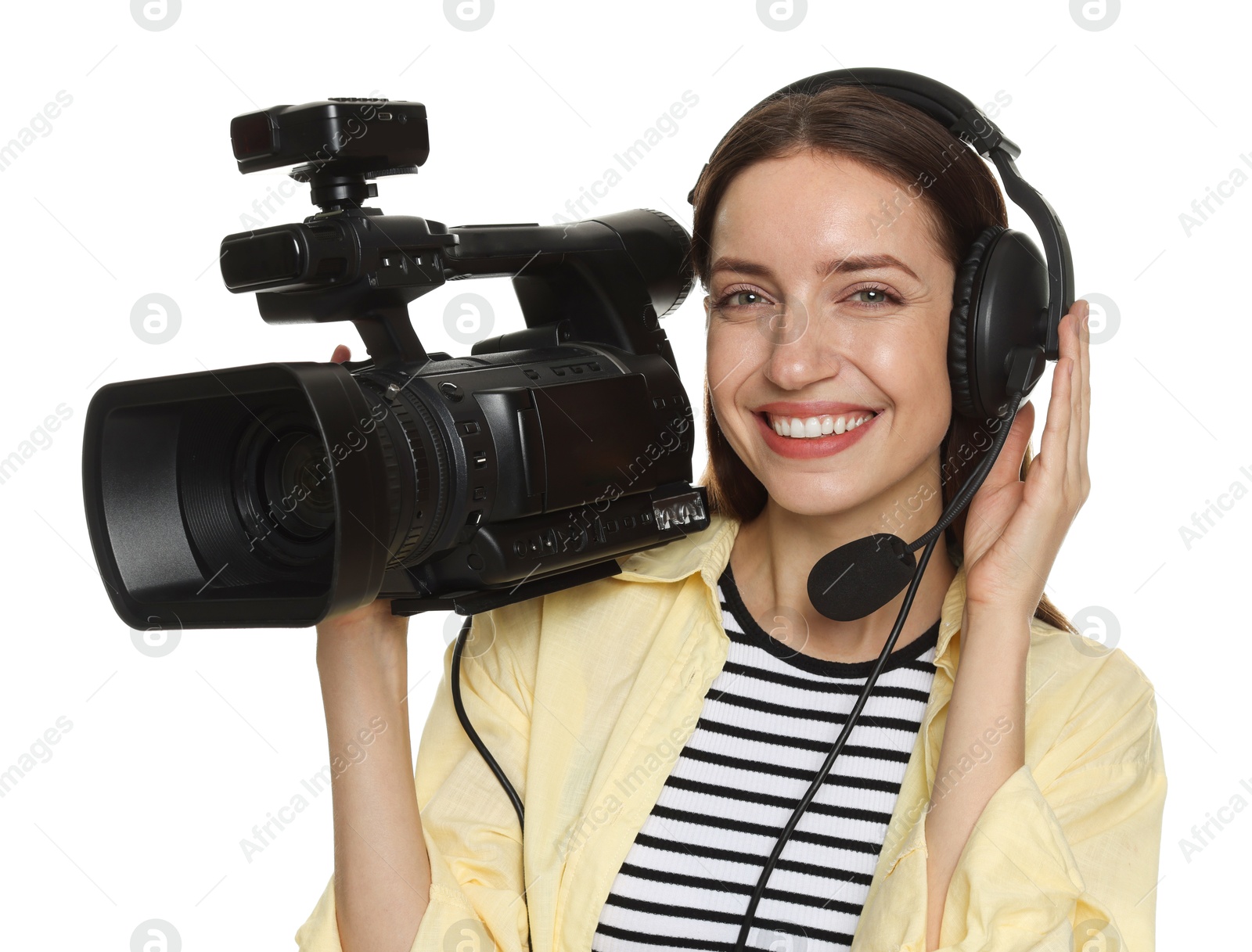 Photo of Happy woman with professional video camera and headset on white background