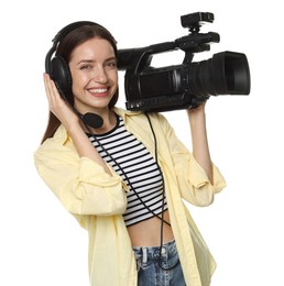 Photo of Happy woman with professional video camera and headset on white background