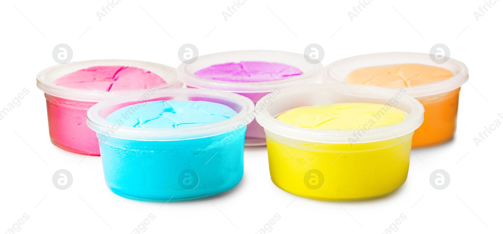 Photo of Different colorful modeling clay in plastic jars isolated on white