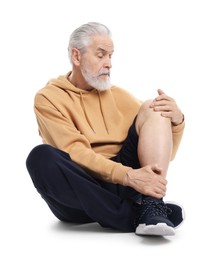 Photo of Senior man suffering from knee pain on white background