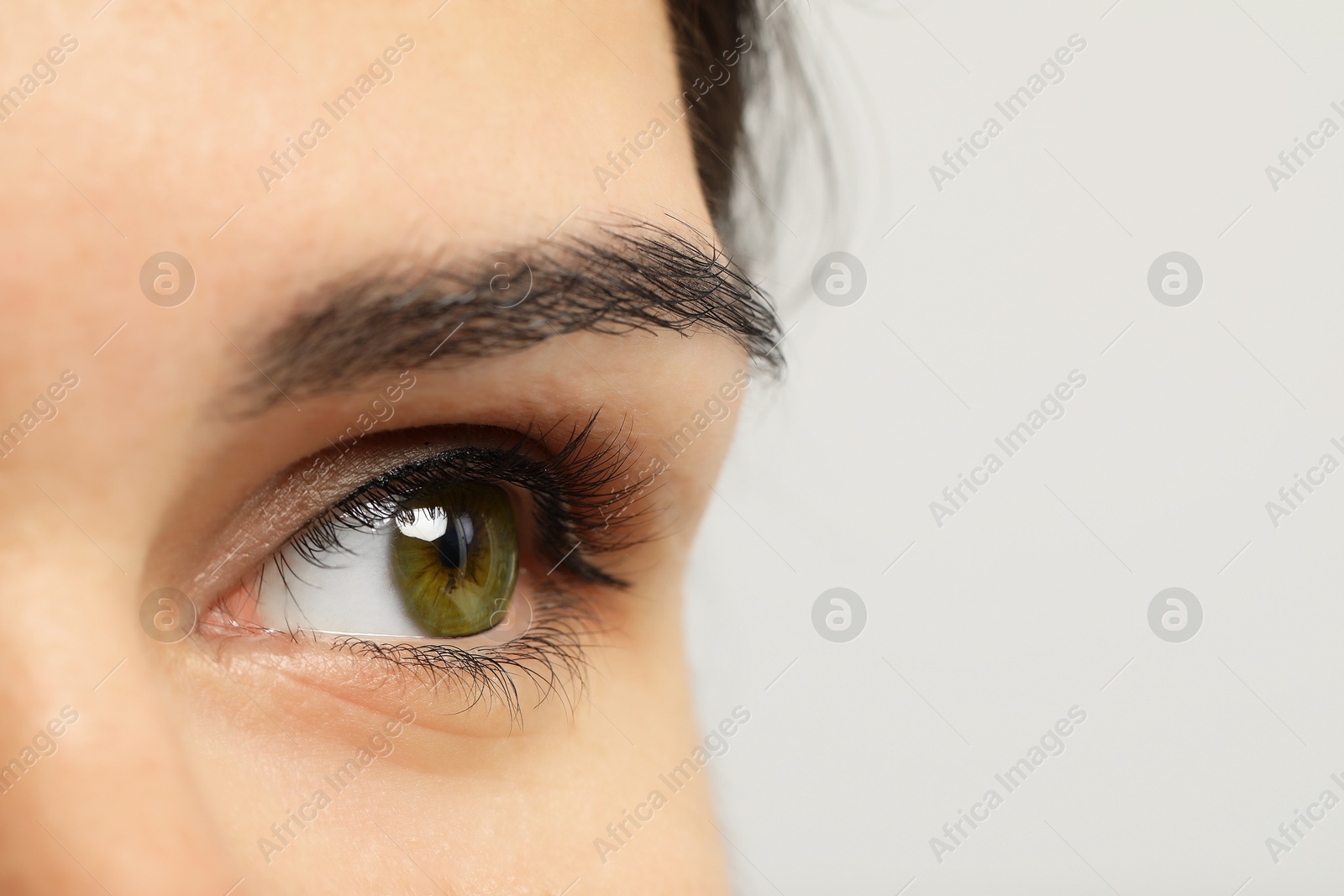 Image of Closeup view of woman with green eyes