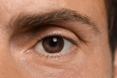 Image of Closeup view of man with brown eyes