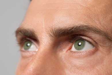 Image of Closeup view of man with green eyes